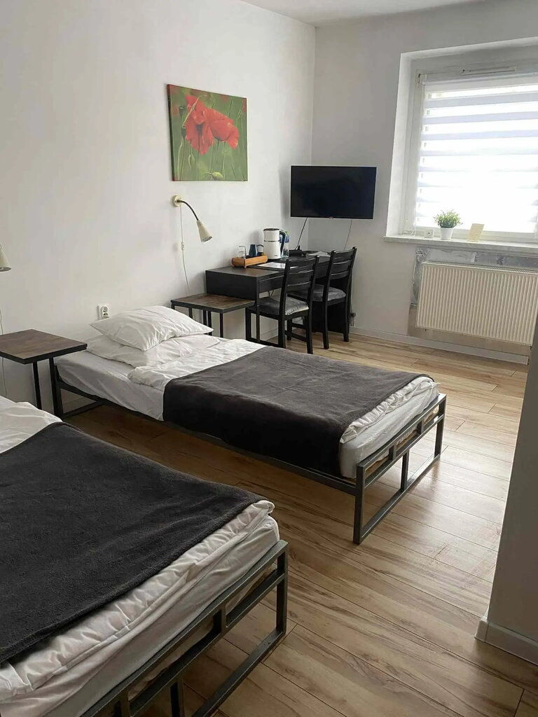 Comodi letti singoli in una camera doppia a Poznań